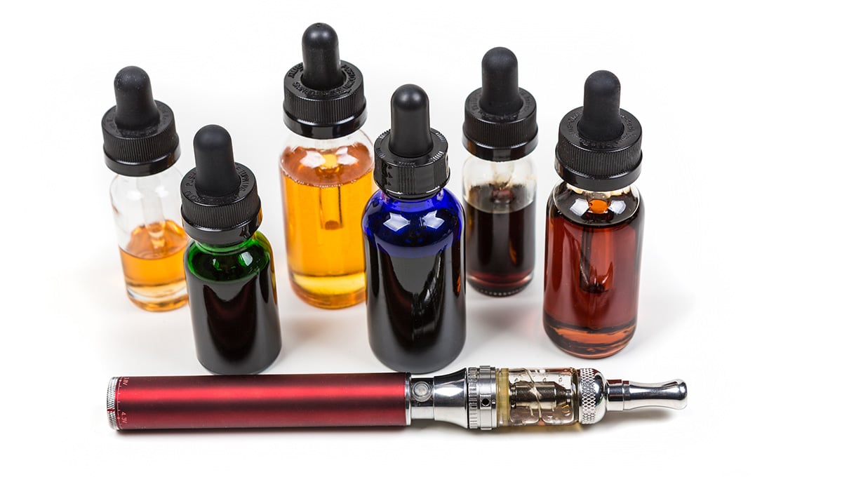 a group of bottles with liquid in them